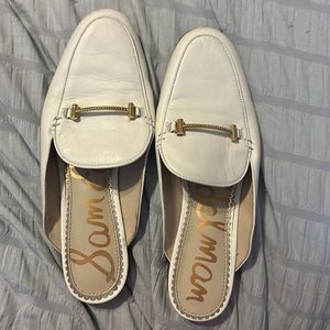 Sam Edelman leather upper slip on loafer with gold detail.